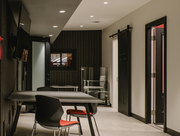 The final design solution by Studio Forma tastefully weaves together a range of design elements, including a bold color palette that mirrors Buchner Manufacturing's brand, strategic lighting that accentuates key features, and a thoughtful layout that promotes efficient workflow and interaction. The choice of high-quality materials, including custom millwork and sophisticated finishes, underscores the company's commitment to excellence and attention to detail.